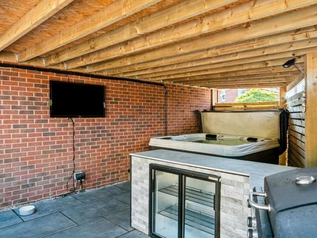 The garden at the £375,000 property also includes this covered storage area.