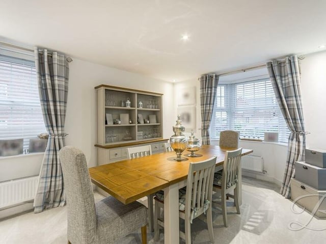 The ground floor has the added bonus of a second reception room, which can be used as a formal dining room, snug or even a home office. The bay window faces the front of the Orion Grove house.