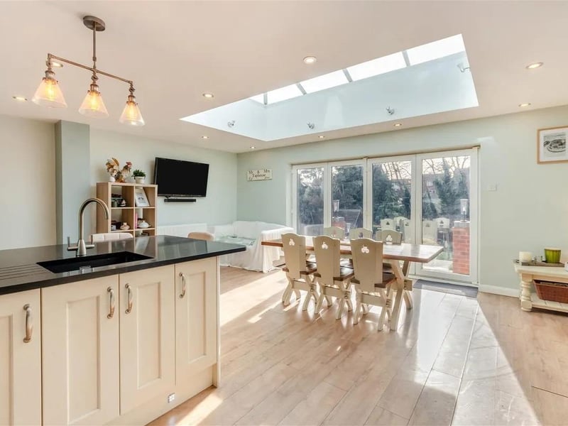 The light and bright open plan living/dining/kitchen features bi-folding doors leading out onto the south facing rear garden.