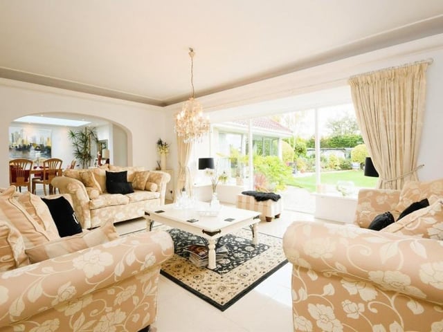 The lounge is part of a luxurious open-plan area of the bungalow that also includes the sitting room, dining room and kitchen. It boasts a delightful view of the back garden via a large, double-glazed window.