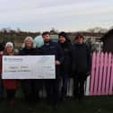 Councillor Angie Jackson and Persimmon Nottingham's Robbie Steel presenting the cheque