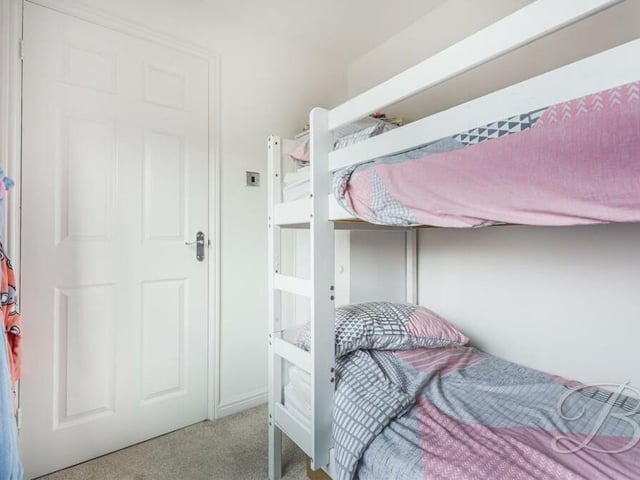 The last of the four bedrooms is a smaller space, but there is still more than enough room for bunk beds and storage, as well as a built-in wardrobe.