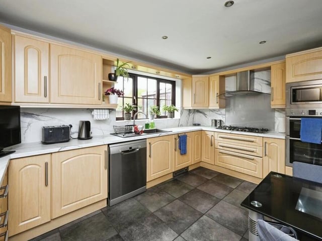 The terrific kitchen features sleek countertops, ample storage space and modern appliances to provide the ideal setting for all culinary adventures.