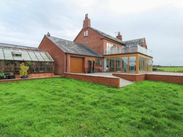 The garden is so big that there is more than enough space for a greenhouse.