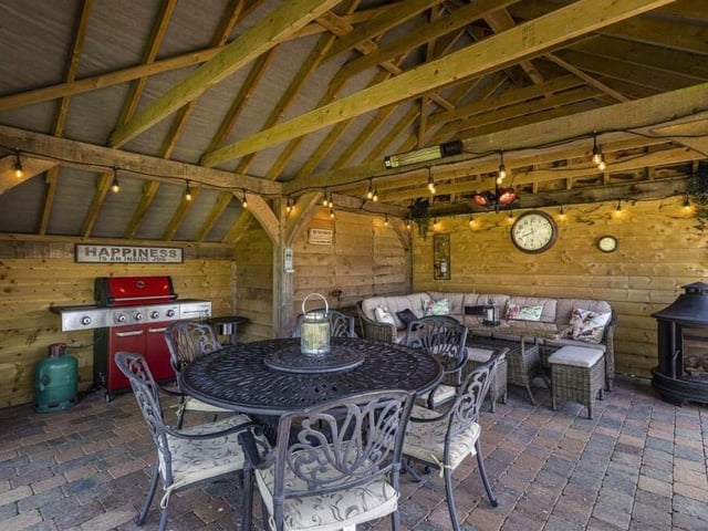 As the notice says, happiness is......spending time in the wonderful gazebo, eating, drinking, socialising, chatting, entertaining or playing games.