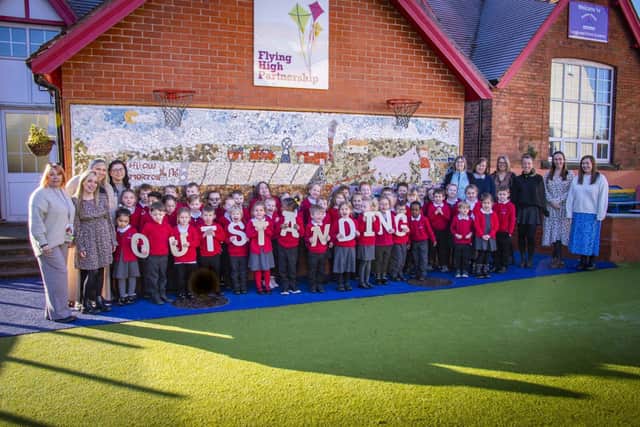 Anne Ingle left with staff and children at Longwood Infant Academy, an Outstanding school