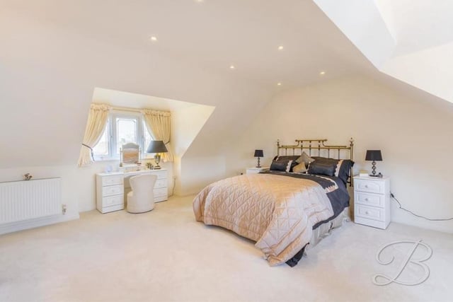 Bedroom number one is the biggest on the first floor. It has a carpeted floor,  double-glazed windows to the front and back of the house, and downlights.