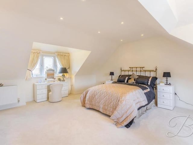 Bedroom number one is the biggest on the first floor. It has a carpeted floor, double-glazed windows to the front and back of the house, and downlights.