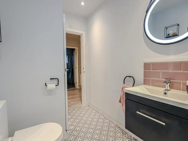 The ground floor boasts a modern shower room with large walk-in shower.
