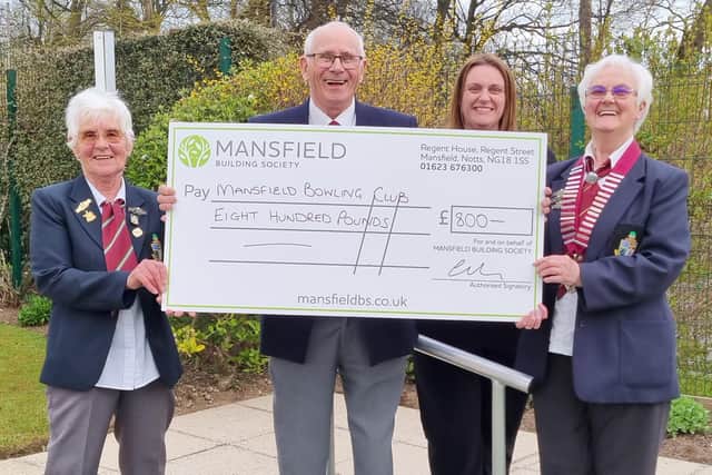 Mansfield Bowling Club member Trevor Barnes receives a cheque from Carol Dallison, of Mansfield Building Society, second from right, watched by club president Margaret Tye and past president Hazel Southerington.