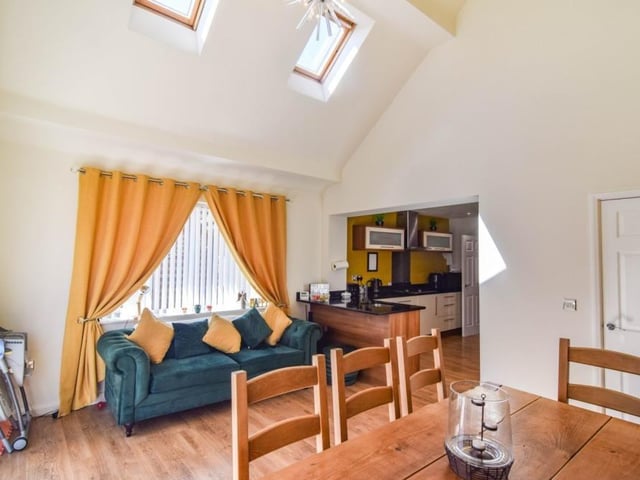 The dining area from another angle. Note its high ceiling and Velux windows.