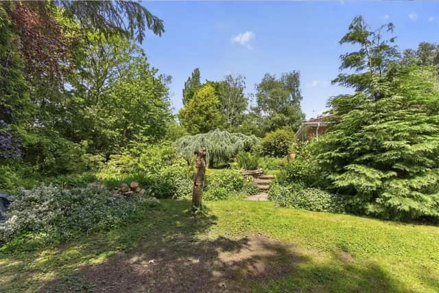 To the rear of the property, there is a most delightful, southwest facing, fully enclosed, wraparound garden