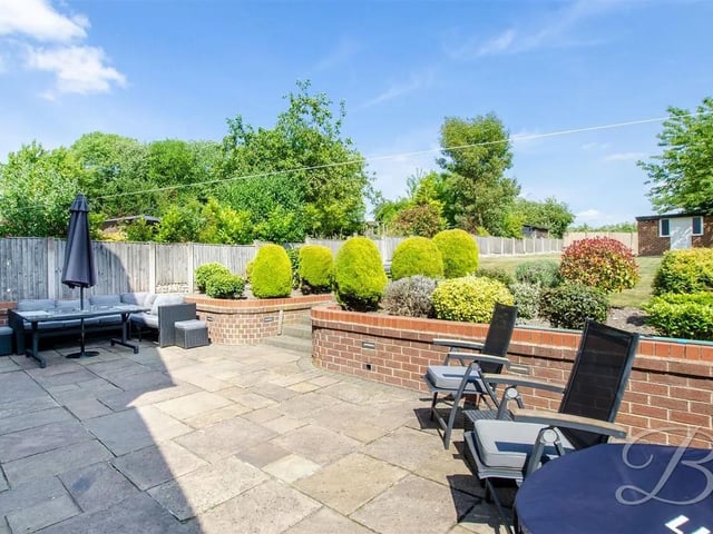 A generous patio seating area is ideal for outdoor dining and entertaining