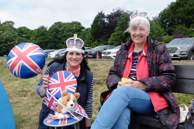 Armed with royal paraphernalia, these two are determined to show their support for Her Majesty.