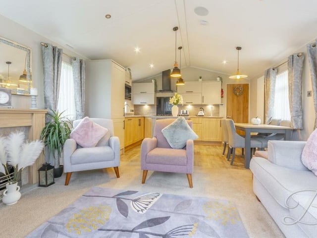 A highlight of the living room is its warm feature fireplace, adding to its homely feel.