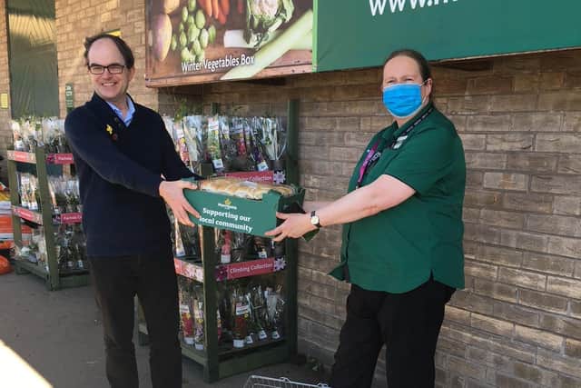 Chapel chairman Paul Frost collects eight dozen hot cross buns from Morrisons in Mansfield Woodhouse.