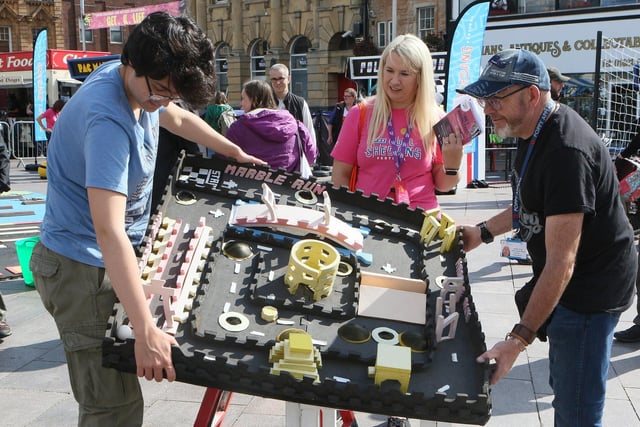 Visitors and organisers playing The Actual Reality Arcade in Mansfield town centre.
