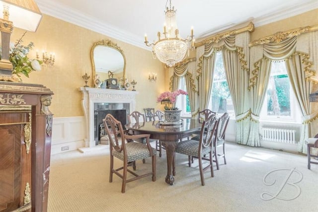 The dining room can only be described as glamorous. With its feature fireplace, fitted carpets and three windows facing the front of the house, it is the ideal spot for sit-down meals or entertaining guests.