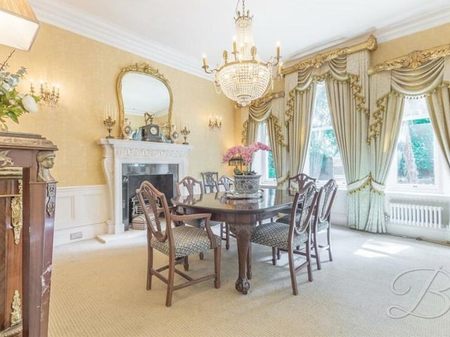 The dining room can only be described as glamorous. With its feature fireplace, fitted carpets and three windows facing the front of the house, it is the ideal spot for sit-down meals or entertaining guests.