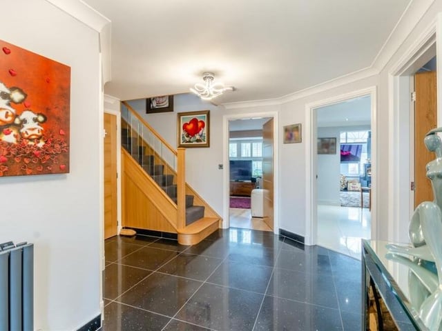 Back into the entrance hall now as we prepare to go up to the first floor. That means negotiating the bespoke Neville Johnson staircase in American white oak with glass balustrade