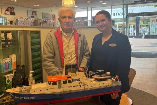 Aimee Ward with a local customer who gifted her a handmade boat
