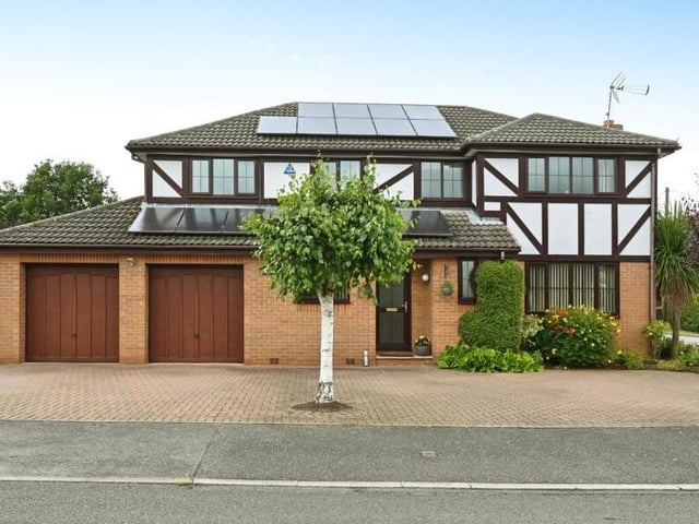 For the final photo in our gallery, let's return to the front of the £500,000-plus Edwinstowe house. A driveway has off-street parking space for four cars and leads to a substantial double garage. Solar panels are fitted to the roof.