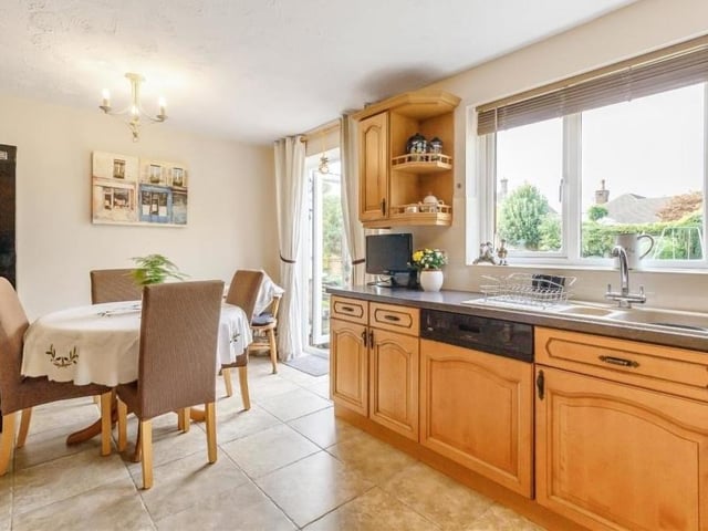 The breakfast kitchen, with its smart, tiled floor, from a different angle, showing how light it is and how French doors lead out to the back garden.
