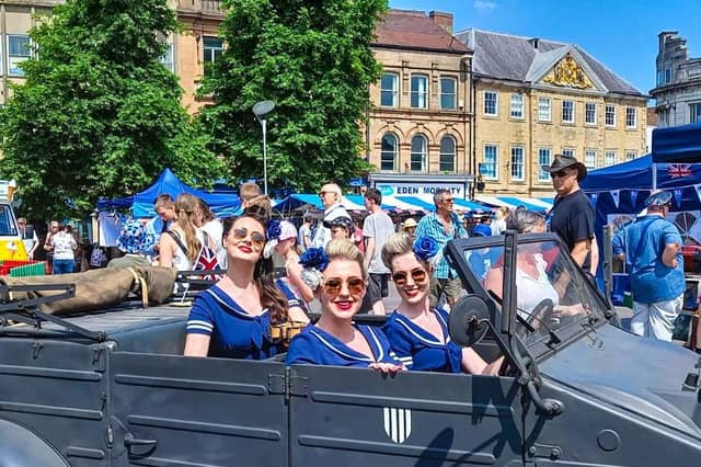 The Bluebird Belles pose for a photo in Mansfield Market Place.