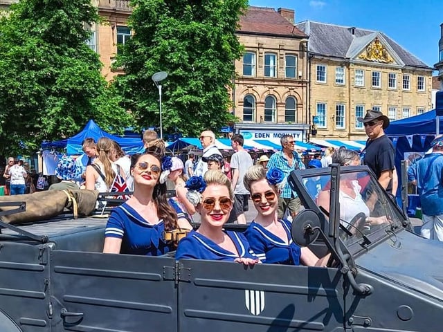 The Bluebird Belles pose for a photo in Mansfield Market Place.