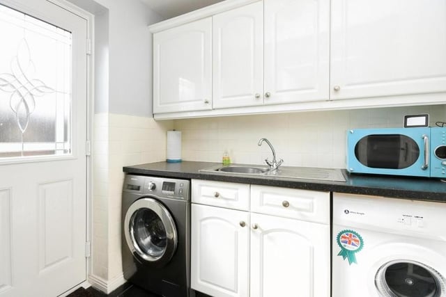 Attached to the kitchen is this very useful utility room. It offers yet more storage, plus space for a washing machine and tumble dryer. The door opens out onto the back garden.