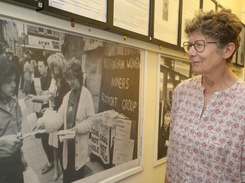 Jane Bramley with a photo of herself and other campaigners during the strike.