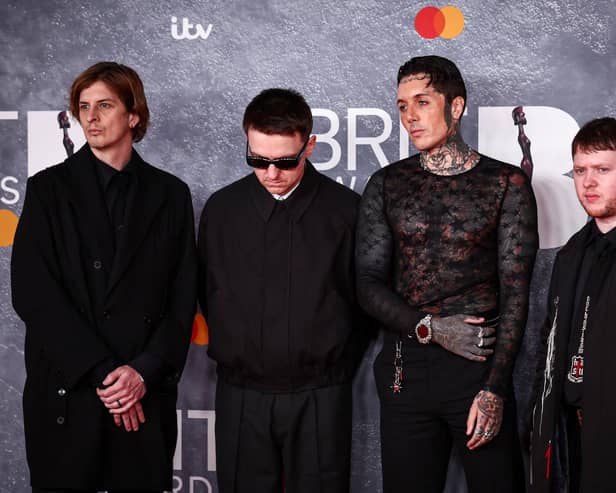 Bring Me The Horizon members Matt Kean, Matt Nicholls, Oliver Sykes and Lee Malia pose on the red carpet upon arrival for the BRIT Awards 2025 in London on March 1, 2025. (Photo by HENRY NICHOLLS / AFP via Getty Images)