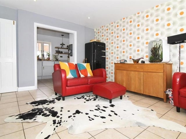 This family room, just off the kitchen, offers more space and versatility to the ground floor.