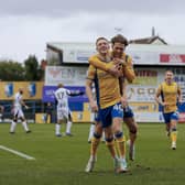 Mansfield Town forward Davis Keillor-Dunn (40) celebrates his first half goal with Will Swan (26) during the Sky Bet League 2 match against Notts County FC at the One Call Stadium, 03 Feb 2024, Photo credit Chris & Jeanette Holloway / The Bigger Picture.media