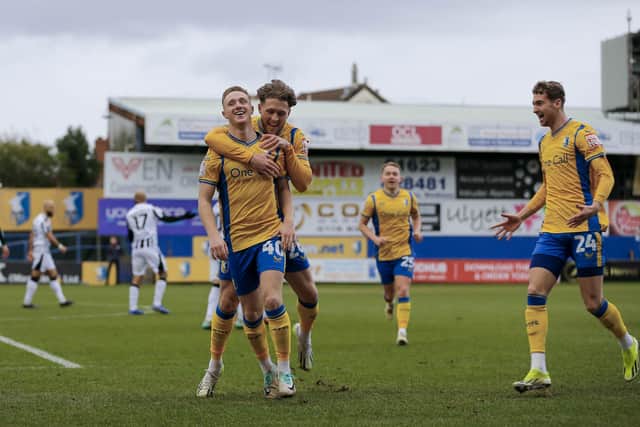 Mansfield Town forward Davis Keillor-Dunn (40) celebrates his first half goal with Will Swan (26) during the Sky Bet League 2 match against Notts County FC at the One Call Stadium, 03 Feb 2024, Photo credit Chris & Jeanette Holloway / The Bigger Picture.media