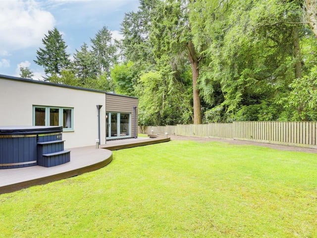 The garden includes a large lawn that is easy to maintain.