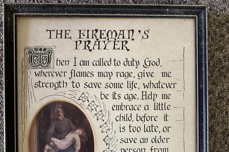 A framed copy of The Fireman's Prayer