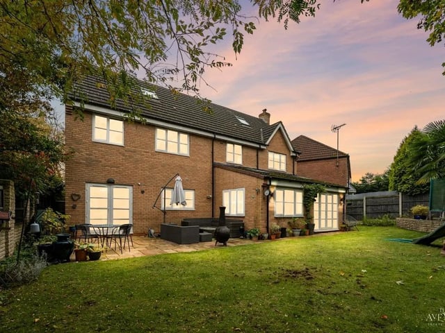 This garden features a large patio area, a beautifully large laid to lawn area, as well as a raised area