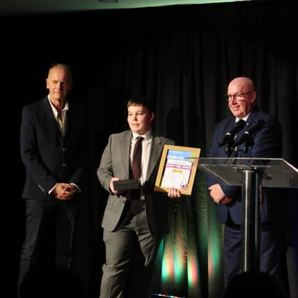 Countywide winner Archie Matthews receiving his award from Council Leader Councillor Mick Barton, and his nominator Paul.