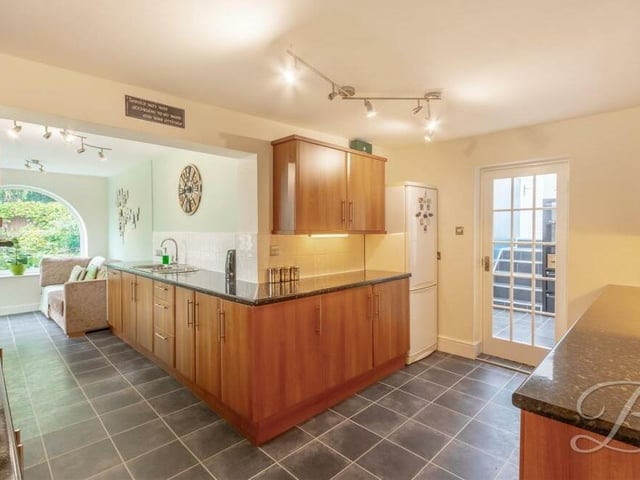 The kitchen has tiled walls, laminate flooring and space for a fridge/freezer. It is full of home comforts.