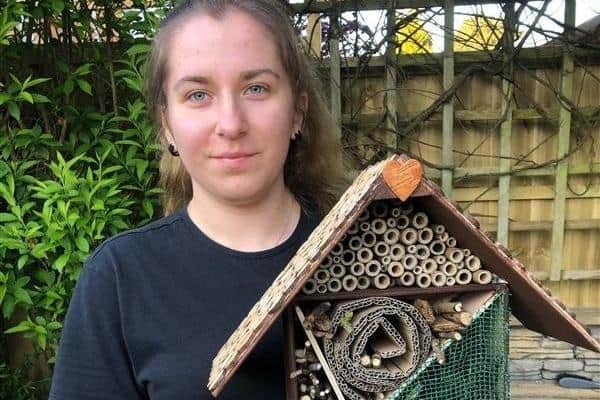 Student Paulina Gasparowicz with her finished bug hotel