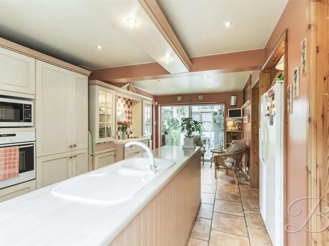 The bright and light kitchen has access into the utility, access into the breakfast room and a door and window to the side elevation.