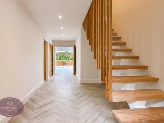 The property has a modern, clean design with an array of features including underfloor heating to the ground floor