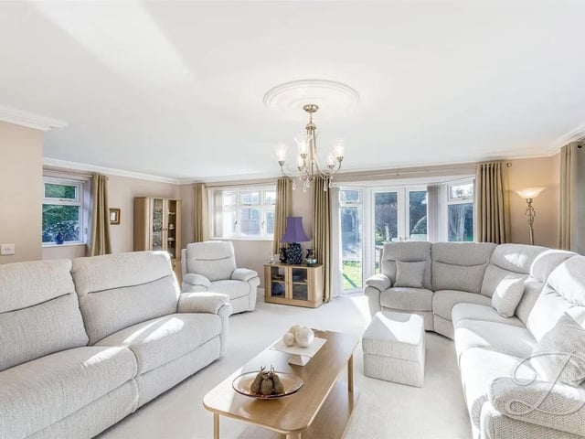 The spacious lounge hosts a feature fireplace and a bright bay window which sets the scene for cosy evenings in.
