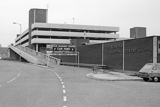 Although the car park looks the same, cars have changed drastically over the decades.