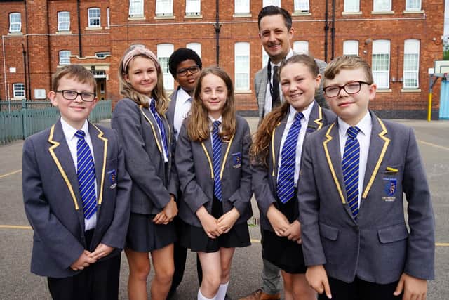 Principal Mark Nunn celebrates the good Ofsted report with pupils Ryan Gollins, Daisy Brown, Progress Ariyo, Maise-leigh Jewsbury, Skye-Faith Barker and Alex Pearl.