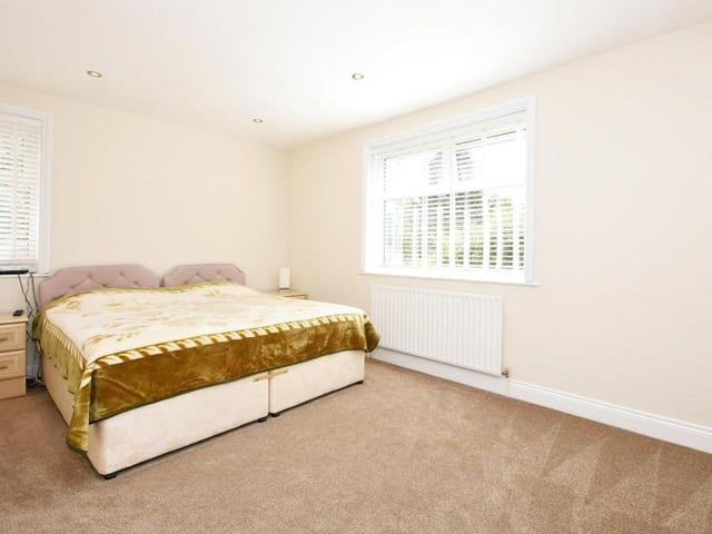 Now we're upstairs, let's take a peek at the first of the six bedrooms. Its generous size hits you between the eyes!
