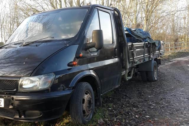 The black drop-side van was seized.