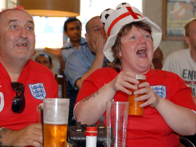 Fans watch World Cup England V Slovenia.