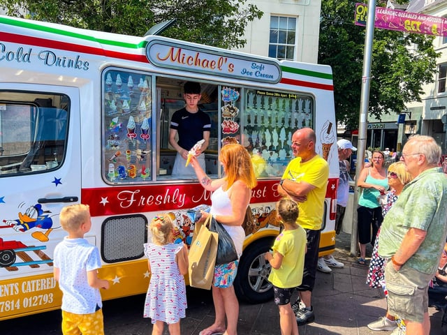 The ice cream man was busy all day as the sun beamed down.